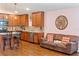 Modern kitchen featuring wood cabinets and a breakfast bar at 205 Bella Verano Way, Davenport, FL 33897
