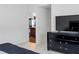Bedroom with view into bathroom and large dresser at 205 Bella Verano Way, Davenport, FL 33897