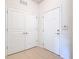 Bright condo entryway with white doors and tile floors at 8298 Portofino Dr # 202, Davenport, FL 33896