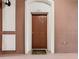 Condo unit entrance with brown door at 8298 Portofino Dr # 202, Davenport, FL 33896