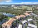 Aerial view of condo community near lake and golf course at 8298 Portofino Dr # 202, Davenport, FL 33896