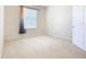Well-lit bedroom featuring a window with blinds and neutral colored carpet at 8298 Portofino Dr # 202, Davenport, FL 33896