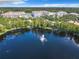 Aerial view of lakefront property with fountain at 8298 Portofino Dr # 202, Davenport, FL 33896