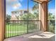 Private screened balcony overlooking a courtyard at 8298 Portofino Dr # 202, Davenport, FL 33896