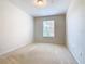 Bright bedroom with a window and neutral colored carpet at 8298 Portofino Dr # 202, Davenport, FL 33896