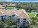 Condo building with lake and lush landscaping at 8298 Portofino Dr # 202, Davenport, FL 33896