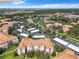 Aerial view showcasing Bella Trae's apartment buildings, parking, and landscaping at 8298 Portofino Dr # 202, Davenport, FL 33896