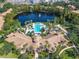 Aerial view of Bella Trae's pool area, with a lake and surrounding amenities at 8298 Portofino Dr # 202, Davenport, FL 33896