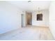 Living room features carpet, access to hallway, and a view into kitchen at 8298 Portofino Dr # 202, Davenport, FL 33896