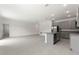 Open living room with tile floors and kitchen island at 188 Bottle Brush, Haines City, FL 33844