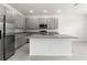 Modern kitchen with stainless steel appliances and granite countertops at 188 Bottle Brush, Haines City, FL 33844