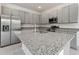 Spacious kitchen featuring granite countertops and stainless steel appliances at 188 Bottle Brush, Haines City, FL 33844
