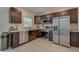 Modern kitchen featuring stainless steel appliances and dark brown cabinetry at 319 St Cloud Rd, Poinciana, FL 34759