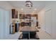 Modern kitchen with dark brown cabinets and stainless steel appliances at 319 St Cloud Rd, Poinciana, FL 34759