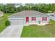 Single-story home with gray siding and red shutters at 319 St Cloud Rd, Poinciana, FL 34759