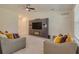 Living room with a modern entertainment center and comfortable seating at 319 St Cloud Rd, Poinciana, FL 34759