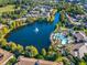 Stunning aerial of lake and community pool at 8362 Bella Tierra Ct, Davenport, FL 33896