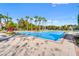 Sparkling community pool with plenty of lounge chairs at 8362 Bella Tierra Ct, Davenport, FL 33896