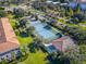 Newly resurfaced tennis court with surrounding green space at 8362 Bella Tierra Ct, Davenport, FL 33896