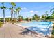 Inviting swimming pool surrounded by lush landscaping at 8362 Bella Tierra Ct, Davenport, FL 33896