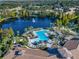 Community pool and lakefront aerial view at 8362 Bella Tierra Ct, Davenport, FL 33896