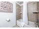 Simple bathroom with shower/tub combo and neutral tile at 8815 Worldquest Blvd # 103 In Building 3, Orlando, FL 32821
