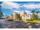 Apartment building exterior with parking and landscaping at 8815 Worldquest Blvd # 103 In Building 3, Orlando, FL 32821