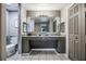 Double vanity, granite countertop, and a toilet in a spacious bathroom at 8815 Worldquest Blvd # 103 In Building 3, Orlando, FL 32821