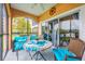 Enjoy this screened lanai with lake views and comfortable seating for outdoor relaxation at 8815 Worldquest Blvd # 103 In Building 3, Orlando, FL 32821