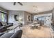 Open concept living and dining area with grey sofas and glass dining table at 8815 Worldquest Blvd # 103 In Building 3, Orlando, FL 32821