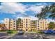 Three-story residential building with ample parking and lush landscaping at 8815 Worldquest Blvd # 103 In Building 3, Orlando, FL 32821