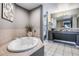 Primary bathroom with a large soaking tub and double vanity at 8815 Worldquest Blvd # 103 In Building 3, Orlando, FL 32821