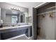Double vanity bathroom with granite countertops at 8815 Worldquest Blvd # 103 In Building 3, Orlando, FL 32821