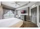 King-size bed, a ceiling fan, and plenty of natural light at 8815 Worldquest Blvd # 103 In Building 3, Orlando, FL 32821