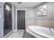 Bathroom with a large soaking tub and walk-in shower at 8815 Worldquest Blvd # 103 In Building 3, Orlando, FL 32821