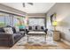 Living room with grey sofas, rug and large windows with water views at 8815 Worldquest Blvd # 103 In Building 3, Orlando, FL 32821