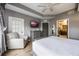 King-size bed, a dresser, and a relaxing armchair at 8815 Worldquest Blvd # 103 In Building 3, Orlando, FL 32821