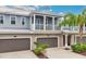 Two story light blue townhome with two car garage at 593 Lake Wildmere Cv, Longwood, FL 32750