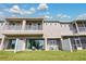 Spacious backyard with patio, screened-in porch, and privacy fence at 593 Lake Wildmere Cv, Longwood, FL 32750