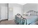 Serene bedroom with a metal bed frame and ample closet space at 593 Lake Wildmere Cv, Longwood, FL 32750