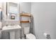 Clean bathroom with pedestal sink and built-in shelving at 593 Lake Wildmere Cv, Longwood, FL 32750