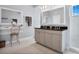 Elegant bathroom with double vanity and large mirror at 593 Lake Wildmere Cv, Longwood, FL 32750