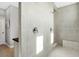 Large walk-in shower with double shower heads and built-in seat at 593 Lake Wildmere Cv, Longwood, FL 32750