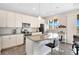 Modern kitchen with white cabinets, granite countertops, and stainless steel appliances at 593 Lake Wildmere Cv, Longwood, FL 32750
