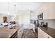 Modern kitchen with white cabinets, stainless steel appliances, and grey countertops at 593 Lake Wildmere Cv, Longwood, FL 32750