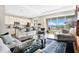 Open concept living room and kitchen with lake views at 593 Lake Wildmere Cv, Longwood, FL 32750