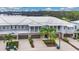 Three story light blue townhomes with lake views at 593 Lake Wildmere Cv, Longwood, FL 32750