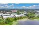 Wide aerial view of townhomes and lake at 593 Lake Wildmere Cv, Longwood, FL 32750