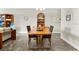 Spacious dining area with wood table and built-in hutch at 593 Lake Wildmere Cv, Longwood, FL 32750