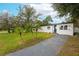 Cute house with a newly paved driveway and palm trees at 920 S Solandra Dr, Orlando, FL 32807